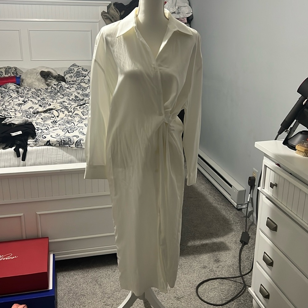 Simple white shirt dress with pockets.